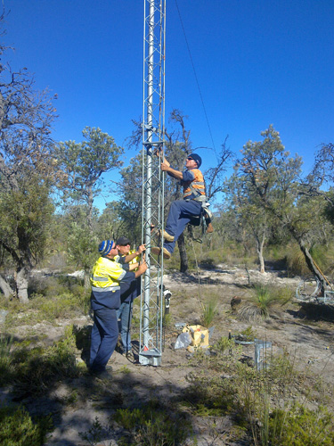 man attaching tower section