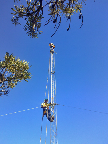 man attaching tower section
