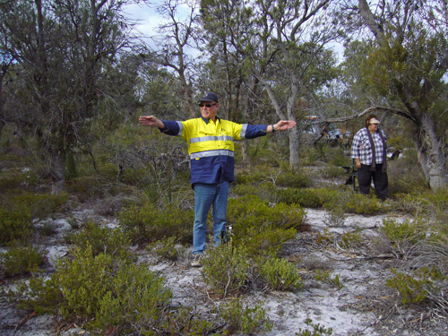 man standing with arms outstretched