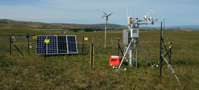 photo of eddy covariance system with pasture in the background